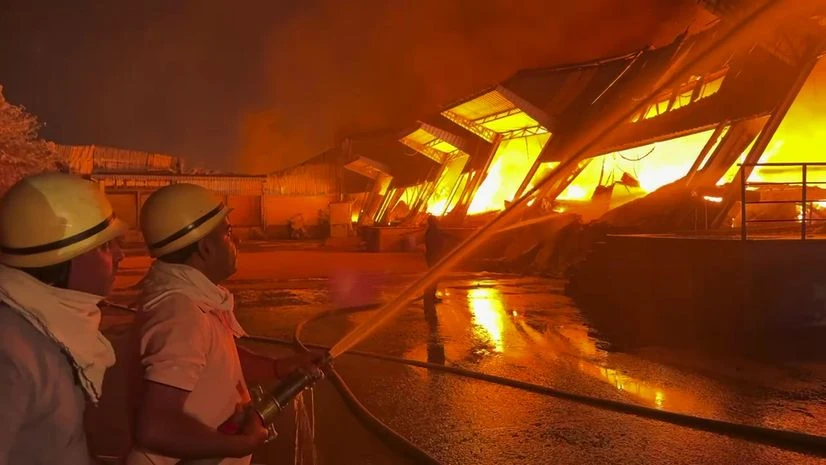Firefighters and fire tendors deployed at the site trying get control of the fire in warehouse. | Photo: PTI Firefighters and fire tendors deployed at the site trying get control of the fire in warehouse. | Photo: PTI