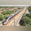 An aerial view of the Delhi-Meerut RRTS route. The erstwhile Planning Commission had noted there would be savings of ~3,180 crore by 2035 for the economy based on assessment of the hourly value of time for commuters in Delhi, Ghaziabad, and Meerut sh An aerial view of the Delhi-Meerut RRTS route. The erstwhile Planning Commission had noted there would be savings of ~3,180 crore by 2035 for the economy based on assessment of the hourly value of time for commuters in Delhi, Ghaziabad, and Meerut sh