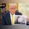 Donald Trump Donald Trump holding a black-and-white picture of a tattooed hand, allegedly Kilmar Abrego Garcia’s.
