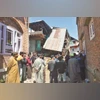 People stand near the demolished house of Adil Thoker, linked to the Pahalgam terror attack	 PHOTo: PTI