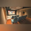 Bass ‘N' Treble-designed custom home theatre in a Moradabad home with a 220-inch screen, 4K projector, and powerful surround sound system hidden behind the screen