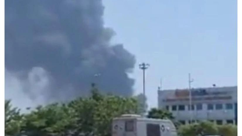 Plane crash, smoke Smoke visible after a plane crashed near Ahmedabad