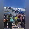 As part of an evacuation operation facilitated by the Indian government, 90 Kashmiri students were evacuated from Iran via Armenia. Visuals from Yerevan Airport show them boarding a commercial flight to India. (PTI Photo)