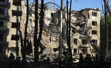 Ukrainian drone strike sparks major fire at Russian oil depot near Sochi Firefighters work in a destroyed apartment building after a Russian attack in Kyiv
