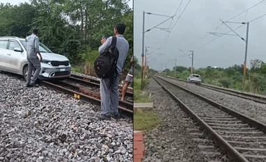 woman drives car on railway track Woman Drives Car on Railway Tracks in Telangana, Disrupting Train Services