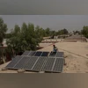 A man washes solar panels installed on a rooftop during a heat wave in Jacobabad, Pakistan A man washes solar panels installed on a rooftop during a heat wave in Jacobabad, Pakistan