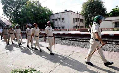 J'khand sets up checkpoints to curb illegal flow of cash, liquor to Bihar Police personnel keep vigil amid 'Bihar bandh' at Sachiwalay Halt Railway station in Patna,