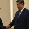 S Jaishankar shaking hands with Xi Jinping