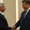 S Jaishankar shaking hands with Xi Jinping