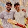 Virat Kohli and Naeem Amin