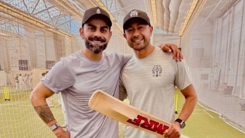 Virat Kohli and Naeem Amin Virat Kohli and Naeem Amin