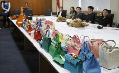 Singapore to sell Hermes bags, gold bars seized from money launderers Hermes bags, Singapore