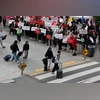 Air Canada, Air Canada protest Passengers walk in front of demonstrators holding placards as Air Canada flight attendants said they will remain on strike and challenge a return-to-work order they called unconstitutional, defying a government decision to force them back to their du