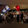 People celebrate after Trump announced that Israel and Hamas agreed on the first phase of a Gaza ceasefire, at the "Hostages square", in Tel Aviv, Israel, October 9, 2025 | REUTERS