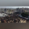 Israel to halve Gaza aid over slow return of dead hostages, tests truce