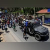 Protesters march alongside a military vehicle during a nationwide youth-led protest over frequent power outages and water shortages, in Madagascar, October 13, 2025 | REUTERS Protesters march alongside a military vehicle during a nationwide youth-led protest over frequent power outages and water shortages, in Madagascar, October 13, 2025 | REUTERS