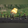 Members of the Japan Ground Self-Defense Force (JGSDF) fire a mortar during a live-fire exercise Members of the Japan Ground Self-Defense Force (JGSDF) fire a mortar during a live-fire exercise