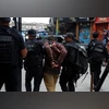64 killed, including 4 police officers, in Rio de Janeiro anti-gang raid A man is detained by police officers during a police operation against drug trafficking at the favela do Penha, in Rio de Janeiro, Brazil October 28, 2025 | REUTERS