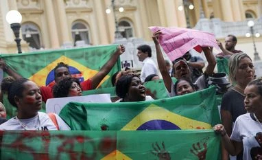 Protests erupt in Brazil after police raid leaves at least 119 dead Residents of the Alemao and Penha favela complexes demonstrate outside the government palace, the day after a deadly police operation against drug trafficking in Rio de Janeiro | REUTERS