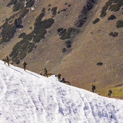 Border blitz Soldiers patrol a snow-covered mountain at a forward post along the Line of Control, ahead of Diwali in Kupwara district in northern Kashmir, on October 19 (Photo: PTI)