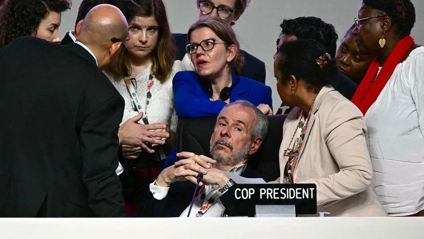 COP30 President André Corrêa do Lago COP30 President André Corrêa do Lago, center, listens to advisers during the closing plenary session at COP30 on Nov. 22
