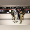 Federal agents patrol the halls of immigration court at the Jacob K. Javitz Federal Building in New York on Aug. 6 Federal agents patrol the halls of immigration court at the Jacob K. Javitz Federal Building in New York on Aug. 6