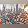 Following cancellation of several IndiGo flights, stranded passengers search for their luggage at the Bengaluru airport on Friday 	photo: pti