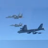 The 6th Air Wing of Japan Air Self-Defense Force's F-15 fighters hold a joint military drill with the U.S. B-52 bomber over Sea of Japan | Reuters The 6th Air Wing of Japan Air Self-Defense Force's F-15 fighters hold a joint military drill with the U.S. B-52 bomber over Sea of Japan | Reuters