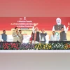PM Narendra Modi at an event to lay the foundation stone of a ₹10,601-crore brownfield ammonia-urea plant in Namrup, along with Union Minister Sarbananda Sonowal (left) and CM Himanta Biswa Sarma (right) | (Photo: PTI)