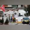 Police officers and firefighters work outside the "Le Constellation" bar, after a fire and explosion during a New Year's Eve party | Reuters