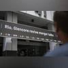 A news headline on Rio Tinto Group and Glencore Plc displayed on a ticker in Perth, Australia A news headline on Rio Tinto Group and Glencore Plc displayed on a ticker in Perth, Australia