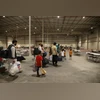 Afghan Special Immigrants walk through the in-processing building at Camp As Sayliyah, Qatar in a handout image released by the US Army in 2021
