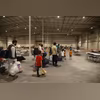 Afghan Special Immigrants walk through the in-processing building at Camp As Sayliyah, Qatar in a handout image released by the US Army in 2021 Afghan Special Immigrants walk through the in-processing building at Camp As Sayliyah, Qatar in a handout image released by the US Army in 2021