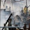 South korea shanty fire, firefighter works