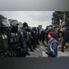 Immigration crackdown reaches Maine as court freezes curbs on protest limit Federal law enforcement officers attempt to disperse demonstrators protesting Immigration and Customs Enforcement (ICE) activity outside the Bishop Henry Whipple Federal Building in St. Paul, Minnesota
