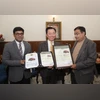 Pham Sanh Chau (centre), CEO, VinFast Asia, and Tapan Ghosh (left), CEO of VinFast India, receive the 5-Star Bharat NCAP safety certification for the VF 6 from Minister of Road Transport and Highways Nitin Gadkari