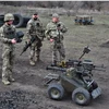 Ukrainian soldiers test a fighting unmanned ground vehicle in Ukraine's Zaporizhzhia region on March 13, 2025 (Photo: Reuters)