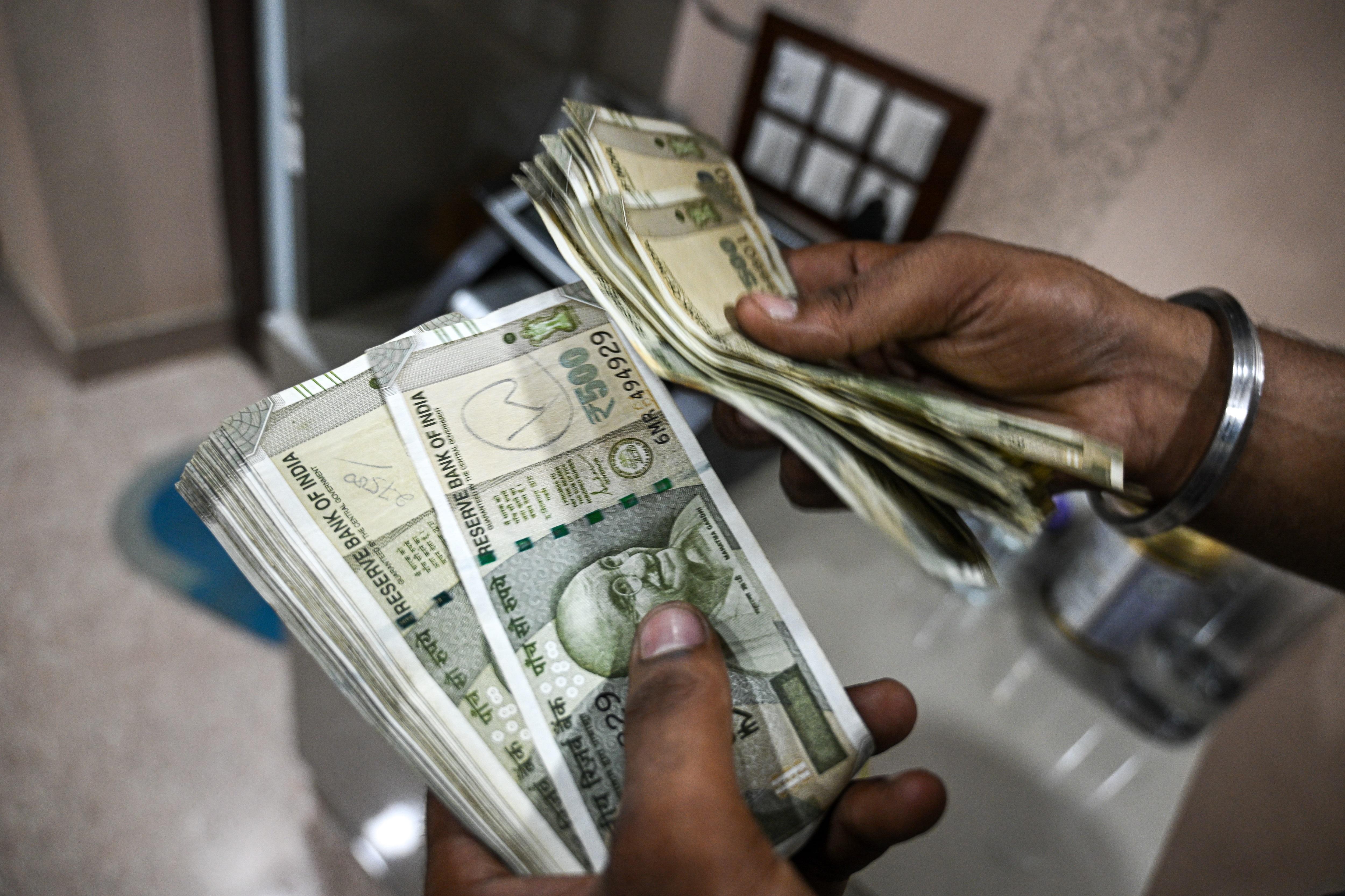 Rupee falls 49 paise to 93.32 against dollar in early trade amid Iran war