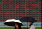 Asian shares are mixed, US futures up as AI fears drag Wall Street lower