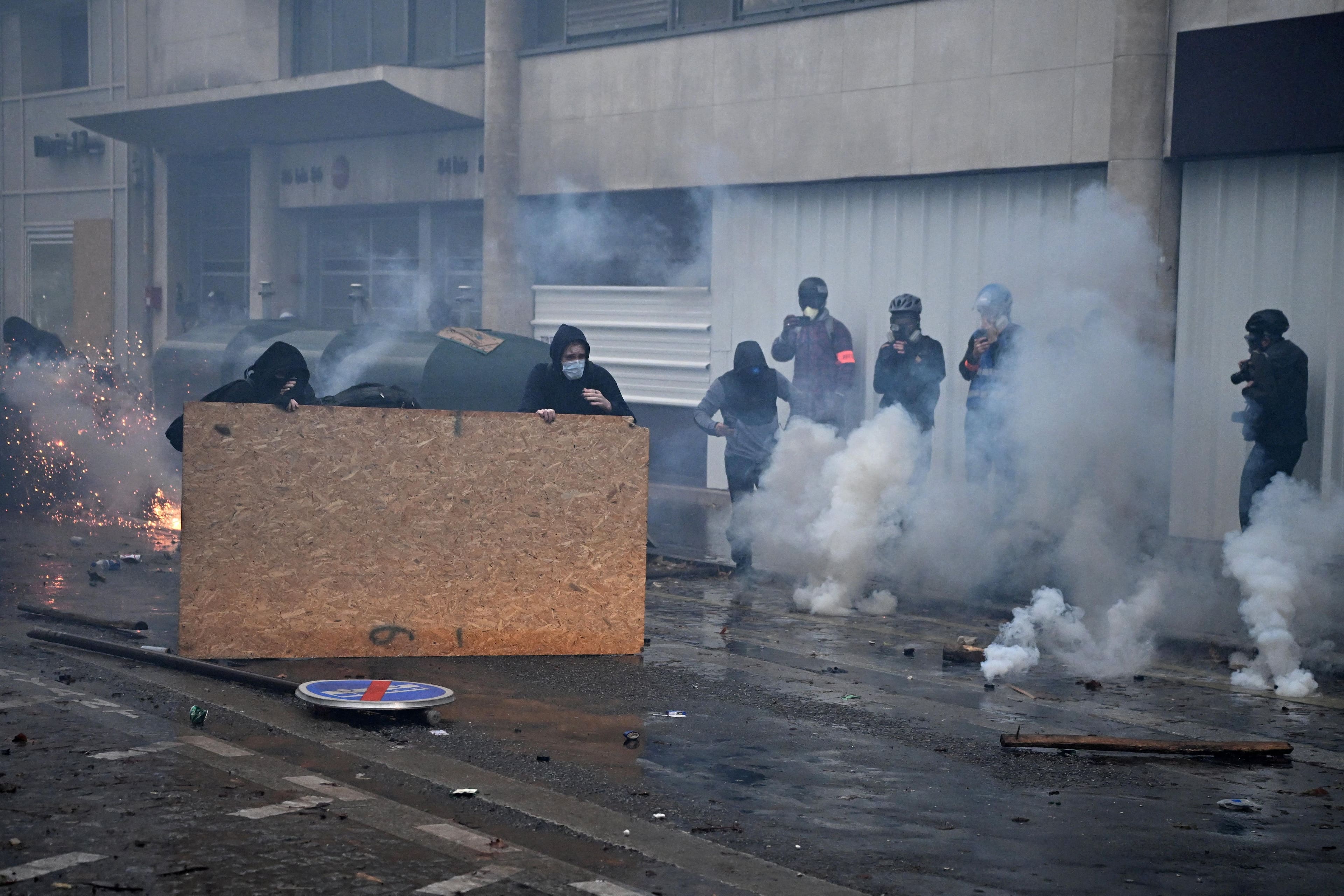 Mass protests challenge Macron as French police fire tear gas, use cannons