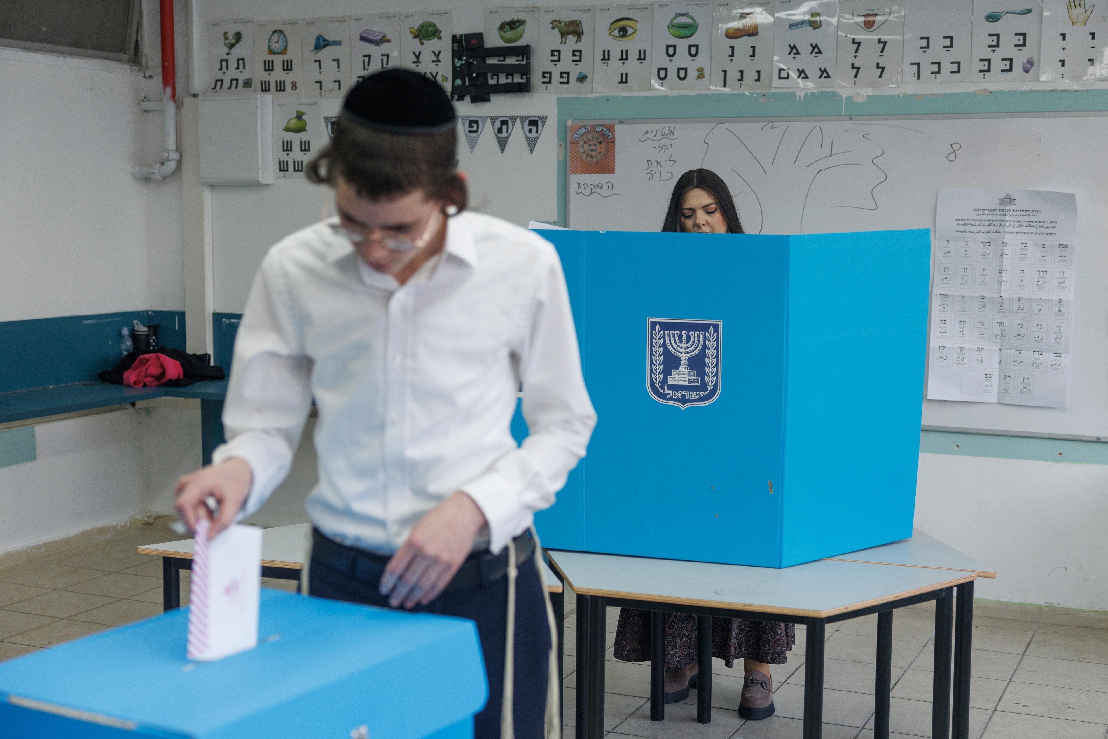 Israel exit polls show tight contest between Netanyahu and Eisenkot