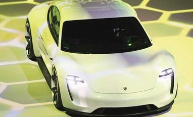 Porsche CEO bids to run sports car brands in revamped VW Porsche takes on Tesla, unveils e-car