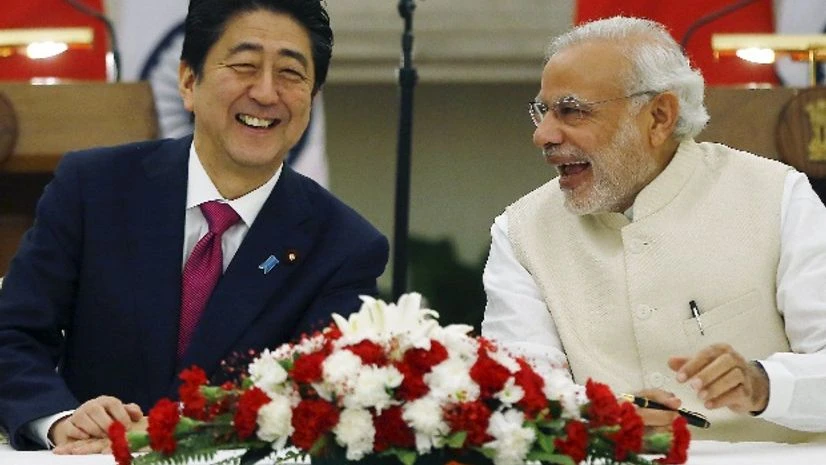 Japan's Prime Minister Shinzo Abe (L) and his Indian counterpart Narendra Modi shares a moment during a signing of agreement at Hyderabad House in New Delhi Japan's Prime Minister Shinzo Abe (L) and his Indian counterpart Narendra Modi shares a moment during a signing of agreement at Hyderabad House in New Delhi