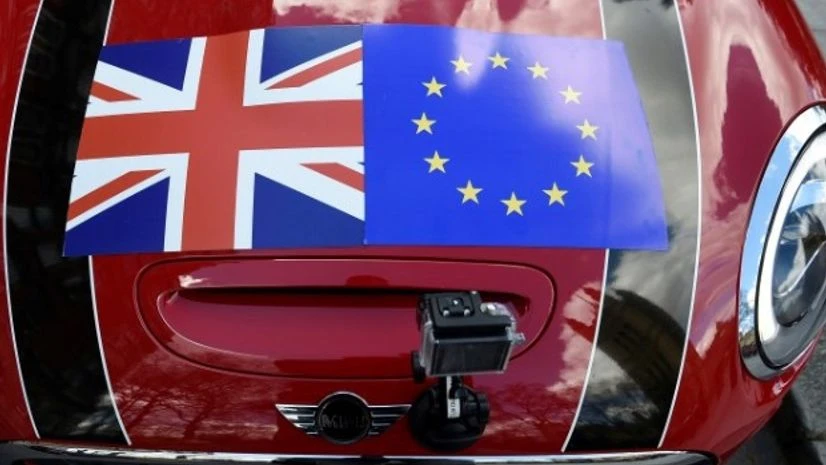 A Mini car is seen with a Union flag and European Union flag design on its bonnet in London A Mini car is seen with a Union flag and European Union flag design on its bonnet in London