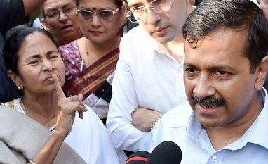Politicians grin and bear it Delhi Chief Minister Arvind Kejriwal and West Bengal Chief Minister Mamata Banerjee talking to media at a dharna against demonetisation of currency notes, in front of Reserve Bank of India in New Delhi