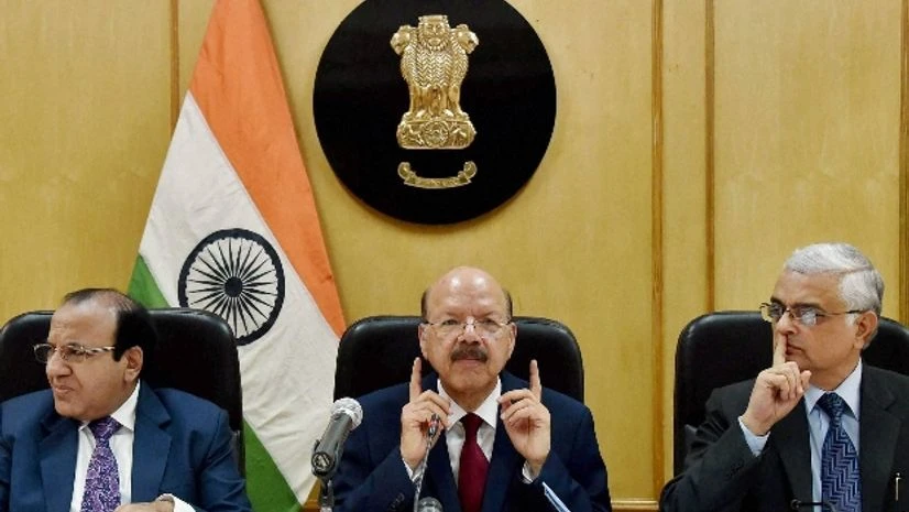 Chief Election Commissioner Nasim Zaidi, along with Election Commissioners Achal Kumar Jyoti and Om Prakash Rawat, announcing poll schedule for five states during a press conference (Photo: PTI) Chief Election Commissioner Nasim Zaidi, along with Election Commissioners Achal Kumar Jyoti and Om Prakash Rawat, announcing poll schedule for five states during a press conference (Photo: PTI)