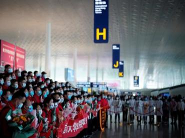 Members of a medical team pose for a group photo at the Wuhan Tianhe International Airport after travel restrictions to leave Wuhan were lifted. Photo: Reuters