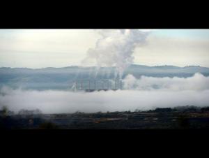 A factory emits smoke