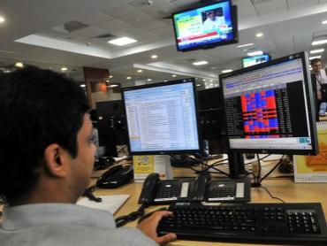 MARKET LIVE: Indices trade higher in volatile session; realty stocks gain