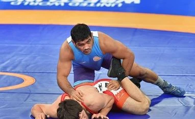 Let people write me off, I am preparing for Tokyo Olympics now: Sushil India's wrestler Sushil Kumar with Bahrain's Adam Batirov in the men's freestyle wrestling (74kg) qualification round at the Asian Games 2018. File photo: PTI